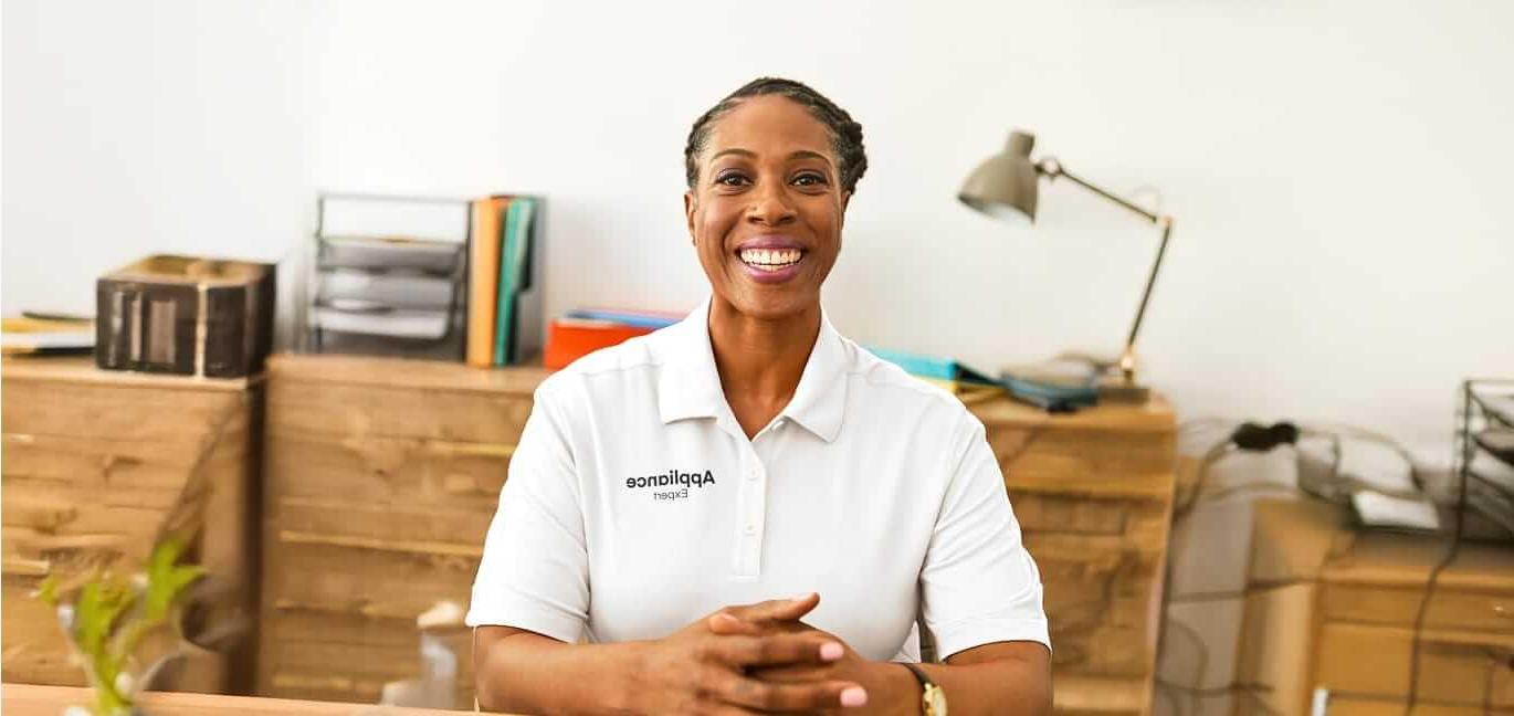 Appliance expert sitting at desk